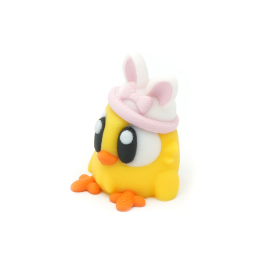 Chick with bunny ears and a bow